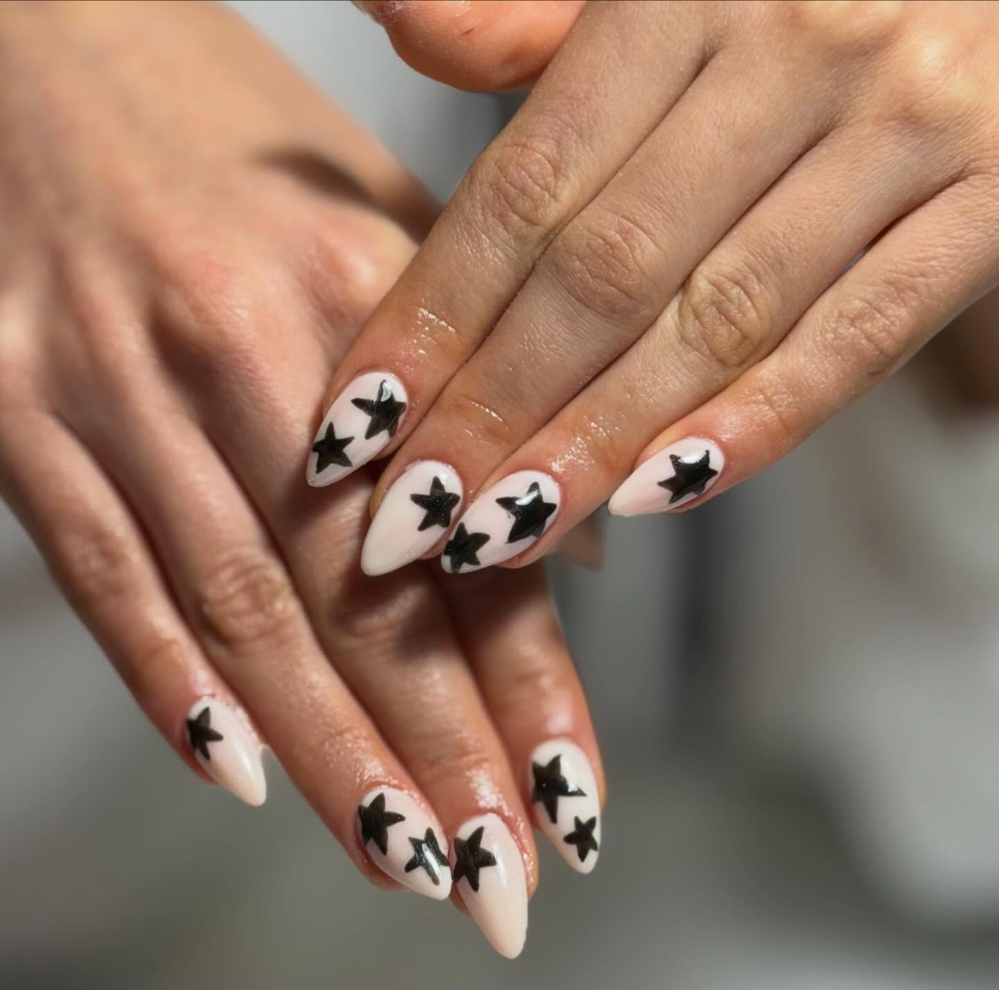 Nude nails with black stars